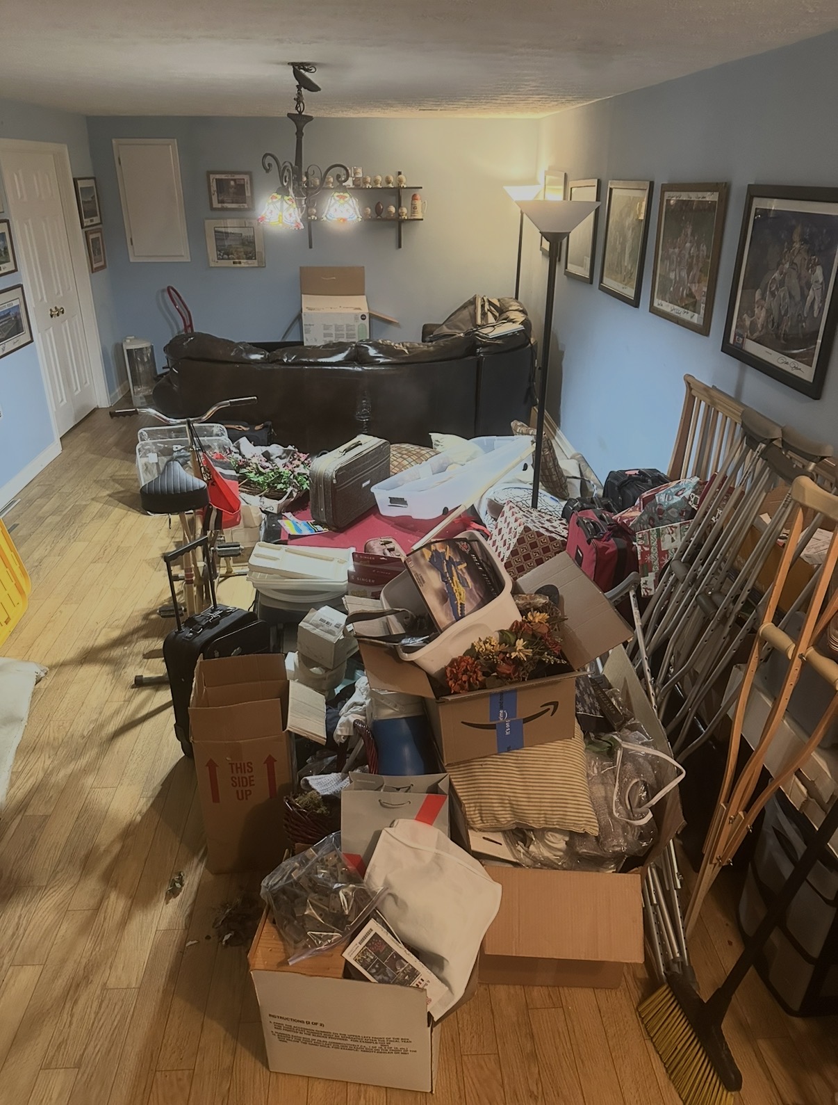 Cluttered living room before a Northern Kentucky home cleanout